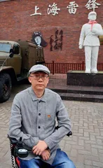 轮椅上的“雷锋传人”