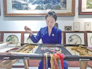 王春艳：一针一线