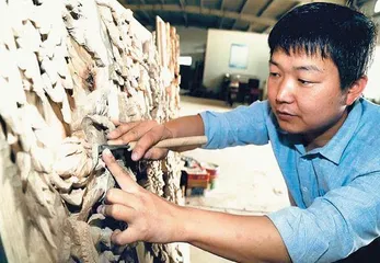 浅谈非物质文化遗产保护政策下的长安木雕发展